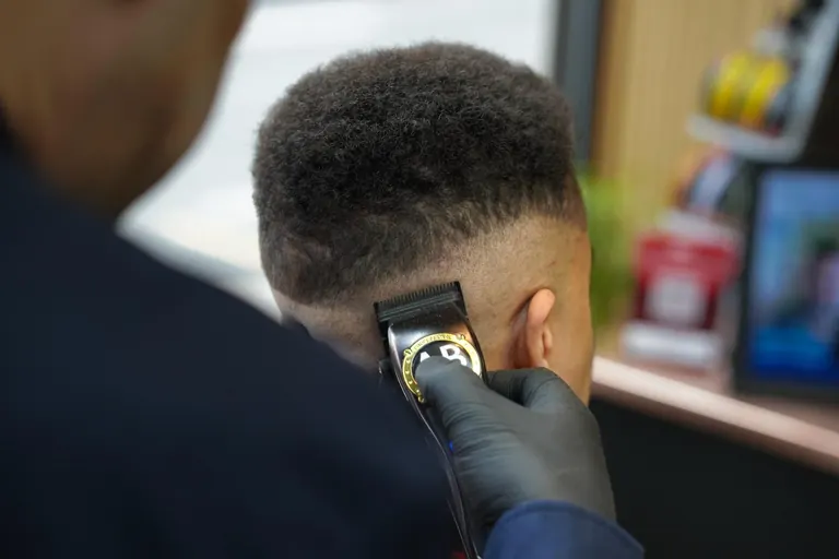AB Barbers, Putney. Clippers on a fade, close up.
