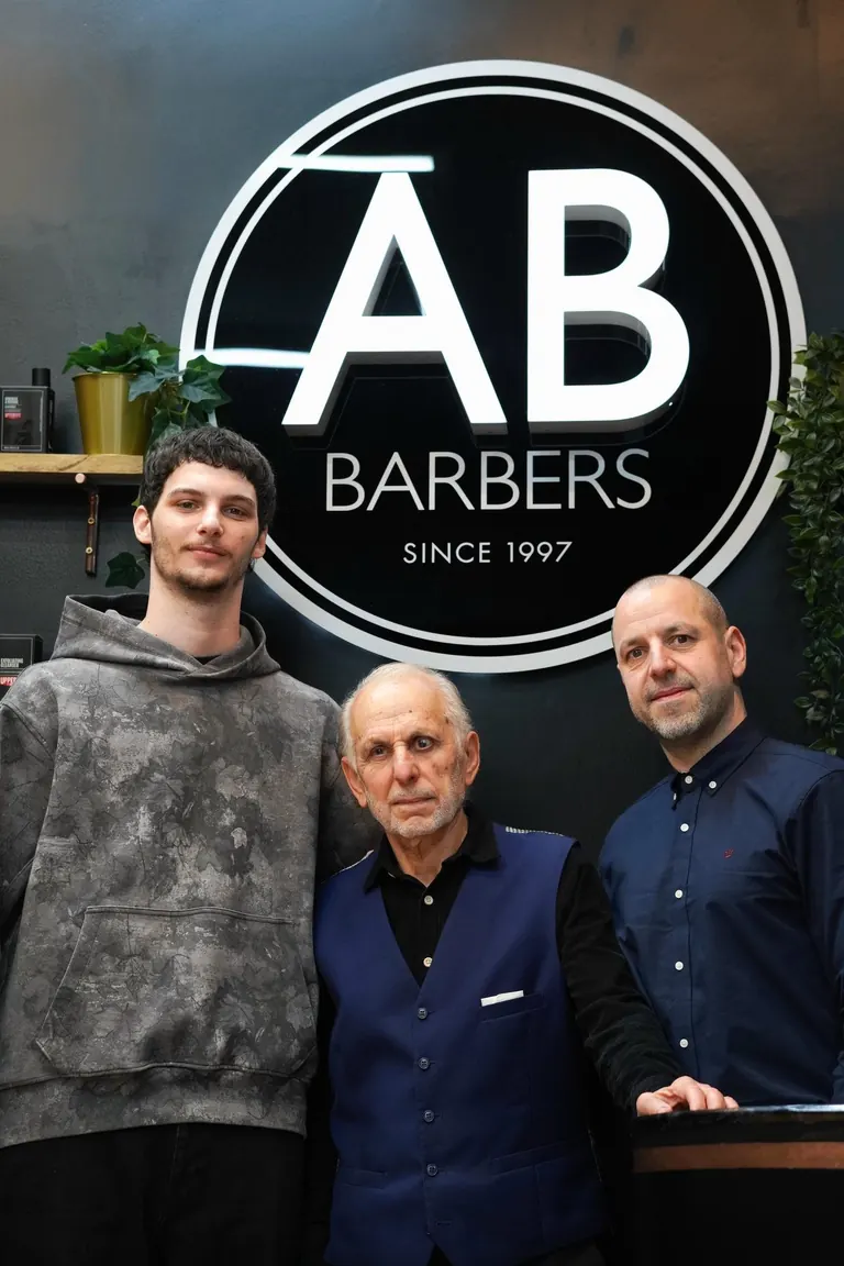 AB Barbers, Putney. The AB Barbers team under the shop's logo.