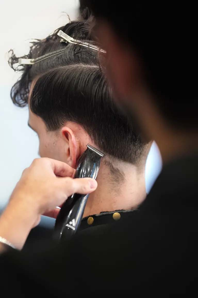 Antonio's Male Grooming, Bromley. Clippers cleaning up the neckline.