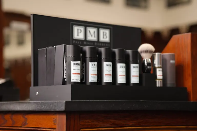 Pall Mall Barbers, London. Pall Mall Barbers own-brand products on the counter.