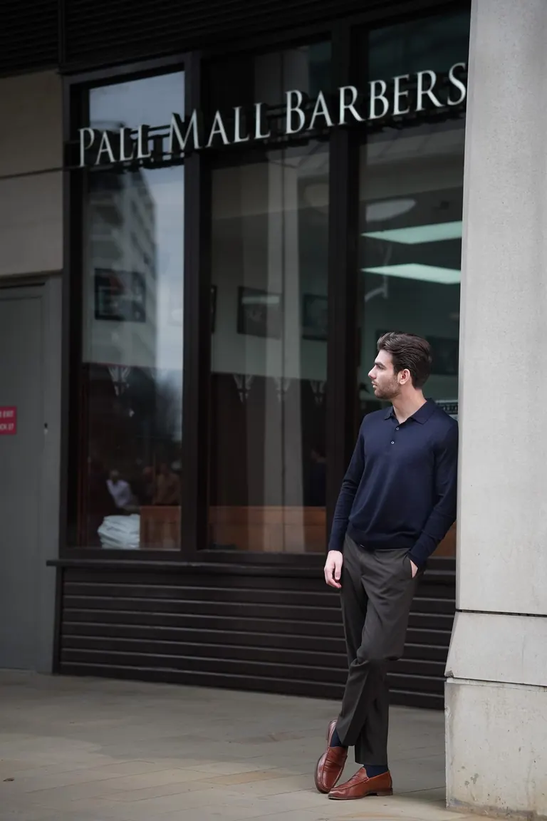 Pall Mall Barbers, London. The Pall Mall Barbers shopfront with a customer outside.